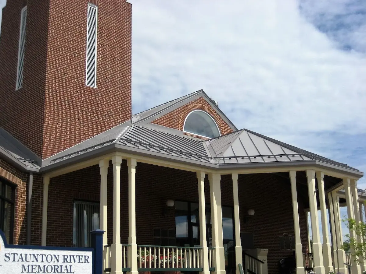 Skilled roofing craftsmen working on a residential roof in Little Falls